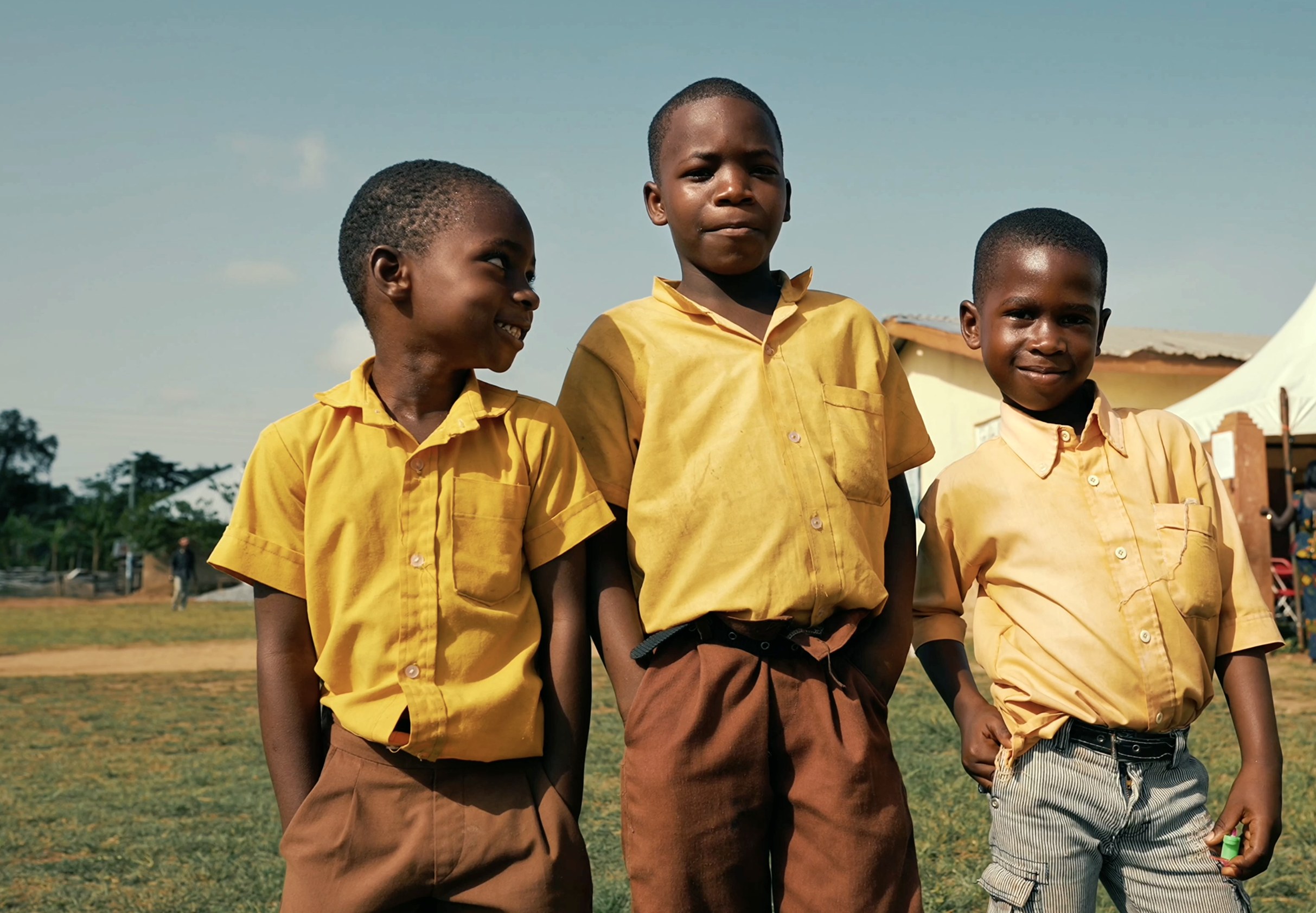Schoolchildren in a host community around the Dompim Pepesa concession